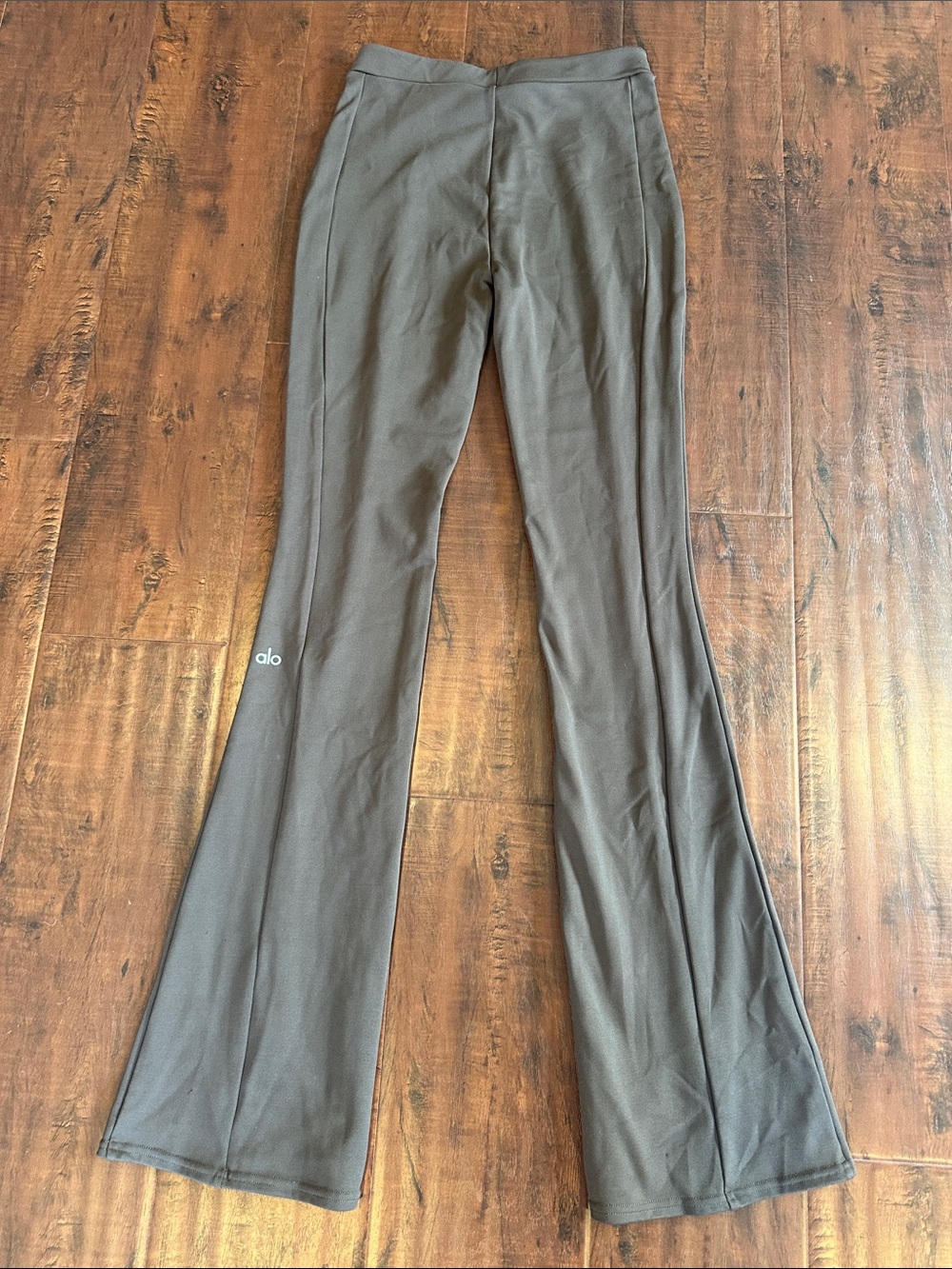 ALO Yoga Women’s Flared Leggings in Dark Olive